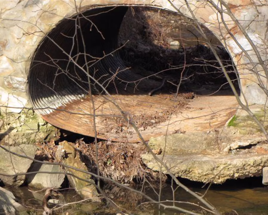 Deteriorated corrugated metal pipe before UAM's Peachtree City rehabilitation project